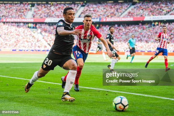 Luis Muriel of Sevilla FC fights for the ball with Lucas Hernandez of Atletico de Madrid during the La Liga 2017-18 match between Atletico de Madrid...
