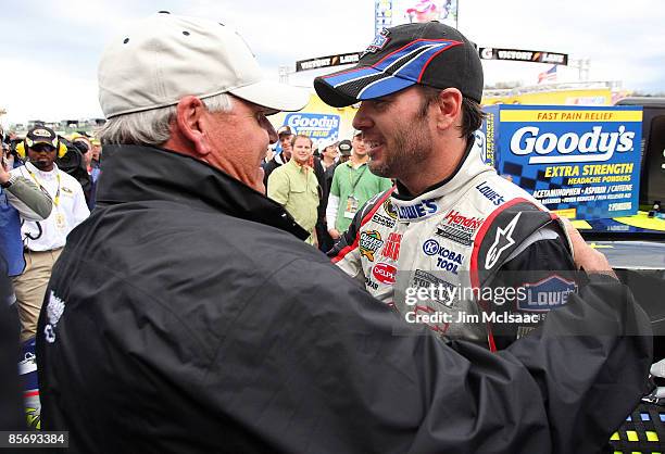 Jimmie Johnson, driver of the Lowe's Chevrolet, celebrates with team owner Rick Hendrick after winning the NASCAR Sprint Cup Series Goody's Fast Pain...