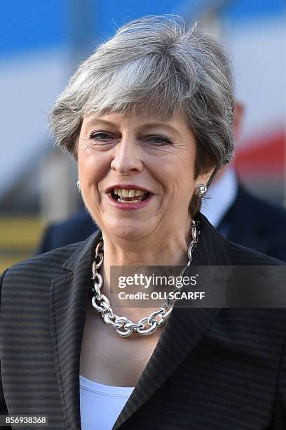 Britain's Prime Minister Theresa May arrives at the Manchester Central Convention Centre in Manchester on October 3 the third day of the Conservative...