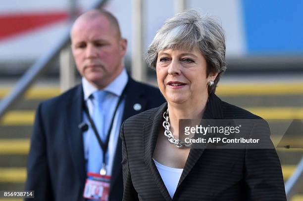Britain's Prime Minister Theresa May arrives at the Manchester Central Convention Centre in Manchester on October 3 the third day of the Conservative...