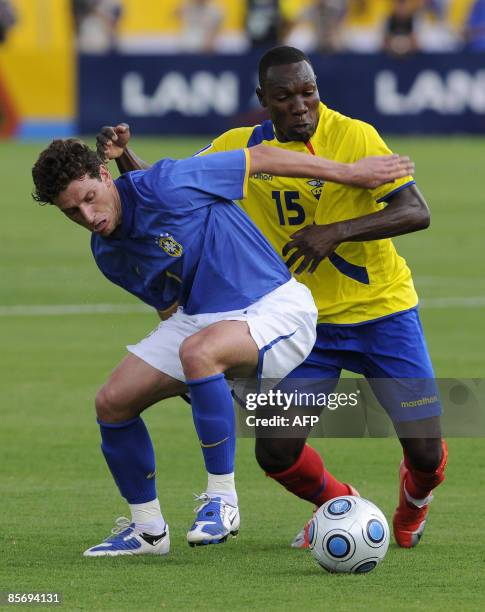 Brazilian Elano vies for the ball with Ecuador's Walter Ayovi during a FIFA World Cup South Africa-2010 qualifier football match at the Atahualpa...