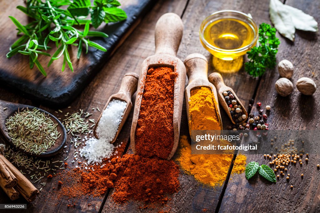 Flavoring: Spices and herbs on rustic wooden table