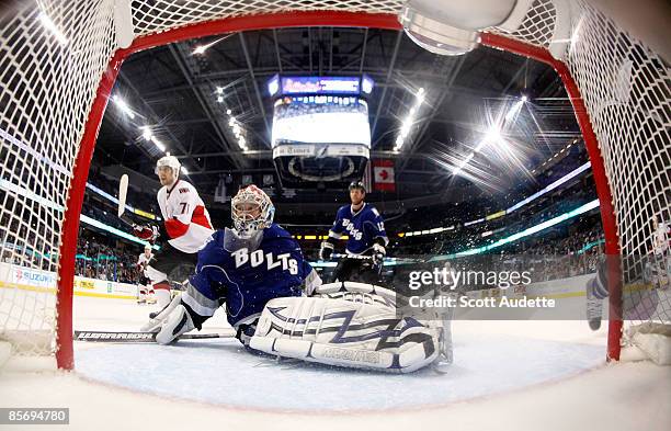 Goaltender Karri Ramo of the Tampa Bay Lightning looks for the puck that went behind the goal during the game against the Ottawa Senators at the St....