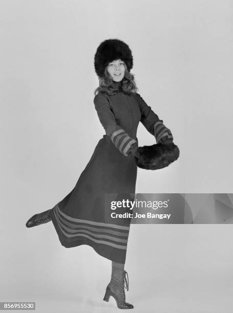 British actress Jenny Agutter wearing a midi dress and fur hat and muff, 1st December 1970.