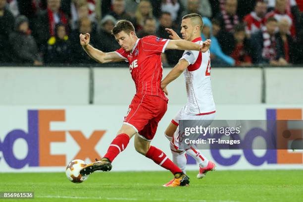 Dominique Heintz of Koeln and Aleksandar Pesic of Belgrad battle for the ball during the UEFA Europa League group H match between 1. FC Koeln and...