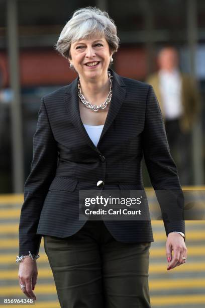 Britain's Prime Minister, Theresa May, walks to her hotel after conducting morning interviews on day three of the annual Conservative Party...