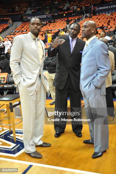 Former NBA players Chis Webber, Dominique Wilkins and Gary Payton attend the Los Angeles Lakers and Atlanta Hawks game at the Philips Arena on March...