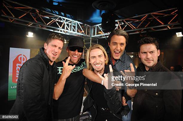 Daniel Adair, Mike Kroeger, Chad Kroeger and Ryan Peake of Nickelback with Ben Mulroney backstage in the E Talk Lounge at the 2009 Juno Awards at...