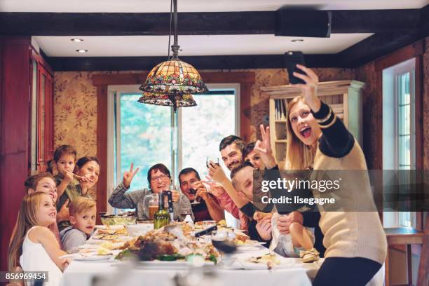 holiday season - big family dinner stock pictures, royalty-free photos & images