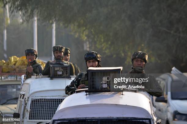 Indian paramilitary troops move towards the gun battle site in Humhama on the outskirts of Srinagar the summer capital of Indian controlled Kashmir...