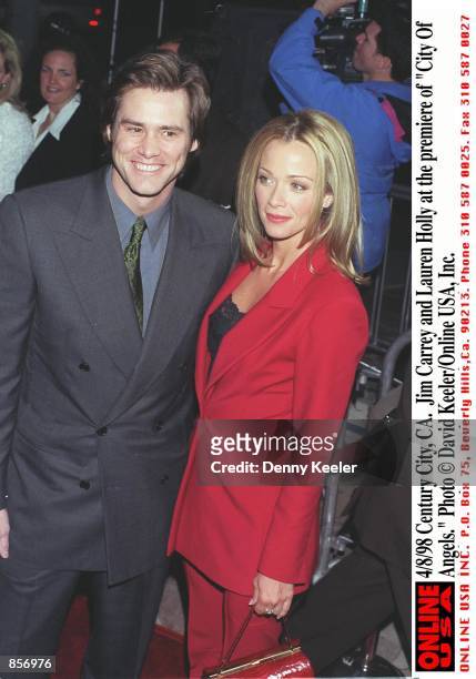 Westwood, CA. Jim Carrey and Lauren Holly at the premiere of "City of Angels."