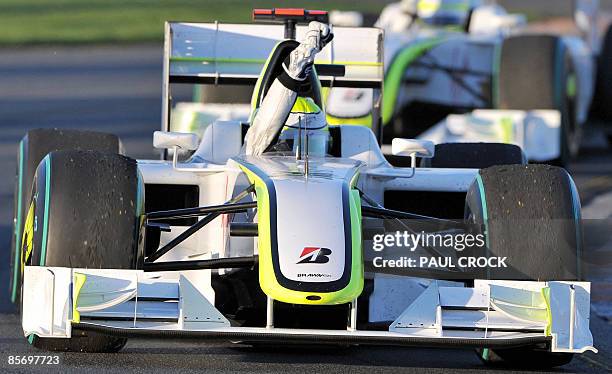 Jenson Button of Great Britain punches the air in his Brawn car after winning Formula One's Australian Grand Prix in Melbourne on March 29, 2009....
