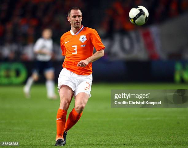 Andre Ooijer of Netherlands runs with the ball during the FIFA 2010 World Cup qualifying match between Netherlands and Scotland at the Arena on March...