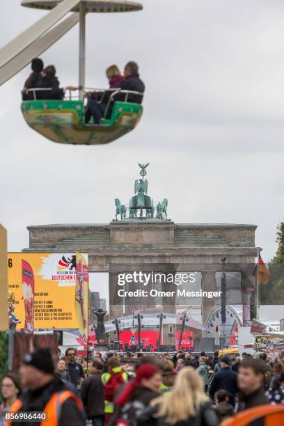 General view of an amusement area set up along 17th of June Street in Tiergarten Park near tthe Brandenburg Gate on German Unity Day on October 3,...
