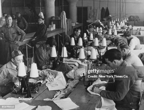 Workroom at the a Federal Transient Service shelter for 500 unemployed men in Los Angeles, 12th December 1934. Residents receive food, clothing and...