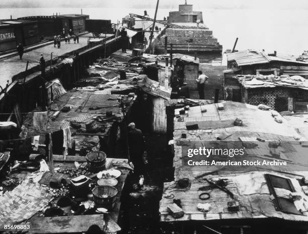 Dockside shantytown or 'Hooverville', built by homeless men during the Great Depression, circa 1935.