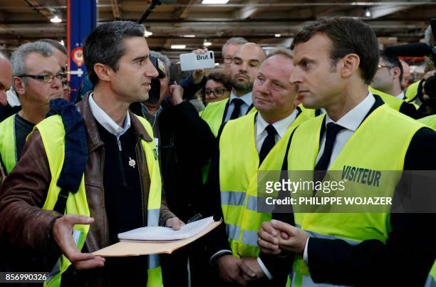 La France Insoumise leftist party's MP Francois Ruffin gestures as he speaks to French President Emmanuel Macron during a visit to the Whirlpool...