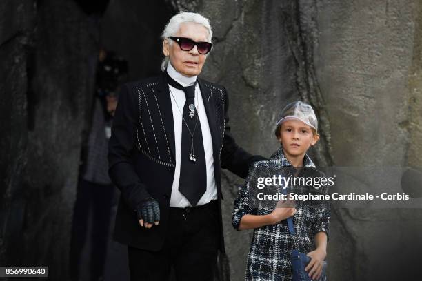 Designer Karl Lagerfeld and Hudson Kroenig walk the runway during the Chanel Spring Summer 2018 show as part of Paris Fashion Week at on October 3,...