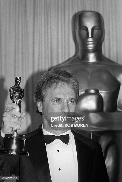 Photo taken on March 25, 1985 shows composer of music for films Maurice Jarre receiving an Oscar award for his score for "A Passage to India" during...