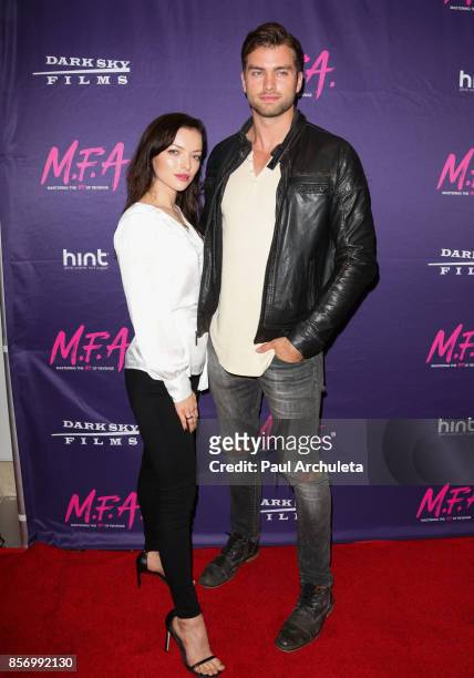 Actors Francesca Eastwood and Pierson Fode attend the premiere of Dark Sky Films' "M.F.A." at The London West Hollywood on October 2, 2017 in West...