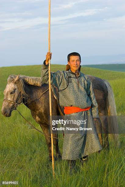 inner mongolia horseman in grasslands holding uurg - xilinhot stock pictures, royalty-free photos & images