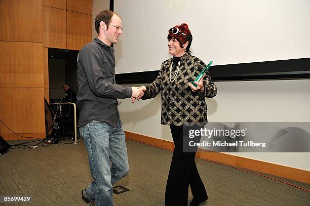 Director Matthew Brown accepts the Best Short Film award for his film "Rain Rain" from actress Jo Ann Worley at the awards ceremony at the Closing...