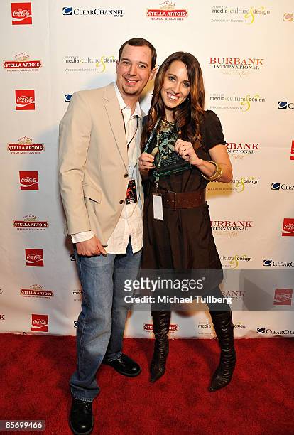 Editor David D'avanzo and director Jolie Hales of the film "Latter Day Fake" show off the award their film won at the Closing Night Gala for the 1st...