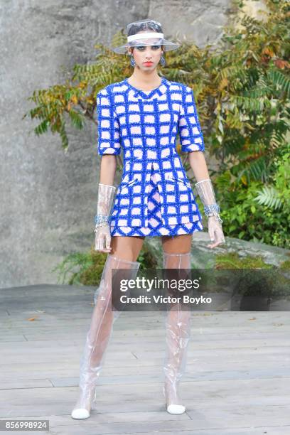 Model walks the runway during the Chanel Paris show as part of the Paris Fashion Week Womenswear Spring/Summer 2018 on October 3, 2017 in Paris,...