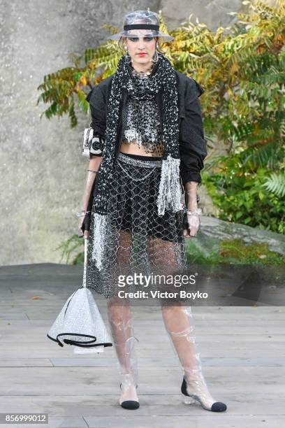 Model walks the runway during the Chanel Paris show as part of the Paris Fashion Week Womenswear Spring/Summer 2018 on October 3, 2017 in Paris,...