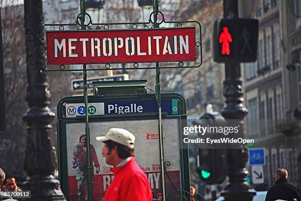 Metro station Place Pigalle in the famous quarter Momartre with the red light district Pigalle in Paris, France on February 25,2009.