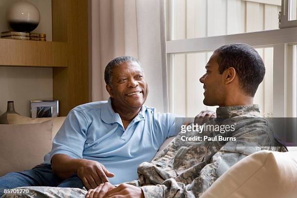father and soldier reunited  - african american soldier bildbanksfoton och bilder