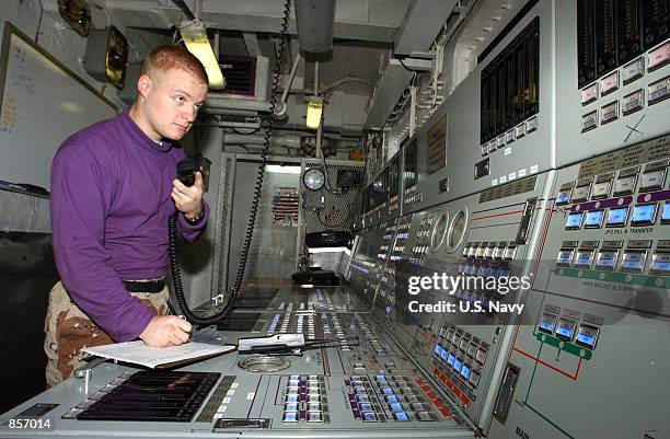 Aviation Boatswain's Mate 3rd Class Timothy Scheanwald from Buckaneer, KY, operates the fuel console in an aviation fuel pump control room February...