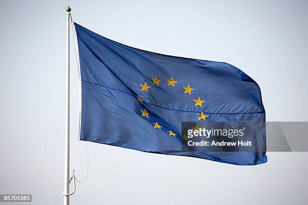 flying blue flag of european union - europe flag stock pictures, royalty-free photos & images