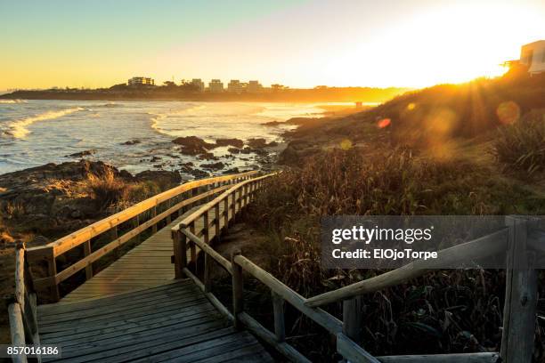 sunset in "la barra" beach, punta del este, uruguay - lazy river stock pictures, royalty-free photos & images