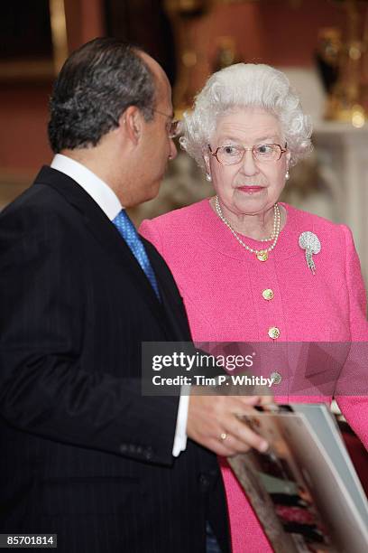 The President of the United Mexican States Felipe Calderon accompanied by Queen Elizabeth II visiting an exhibition of Mexican items from The Royal...