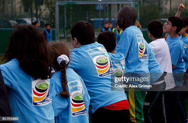 Pupils lean at the board during a training session of a school soccer group on one of the DFB Mini Soccer Fields at the Anne Frank school on March...