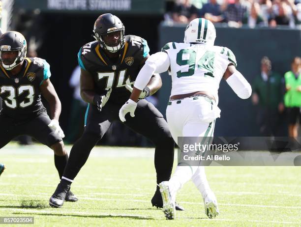 Cam Robinson of the Jacksonville Jaguars in action against Kony Ealy of the New York Jets during their game at MetLife Stadium on October 1, 2017 in...