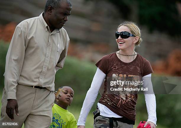 Madonna with her adopted son David Banda visits a project previously set up by her Raising Malawi Foundation at the Namitete Secondary School on...