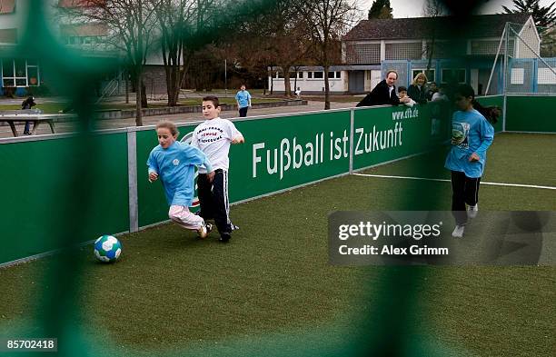 Pupils play soccer during a training session of a school soccer group on one of the DFB Mini Soccer Fields at the Anne Frank school on March 30, 2009...
