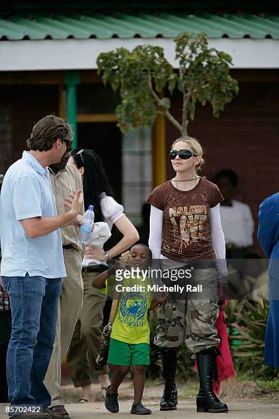 Madonna with her adopted son David Banda visits a project previously set up by her Raising Malawi Foundation at the Namitete Secondary School on...
