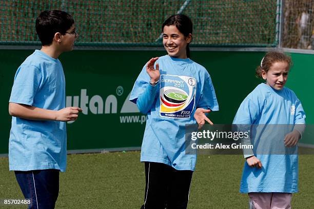 Pupils react during a training session of a school soccer group on one of the DFB Mini Soccer Fields at the Anne Frank school on March 30, 2009 in...