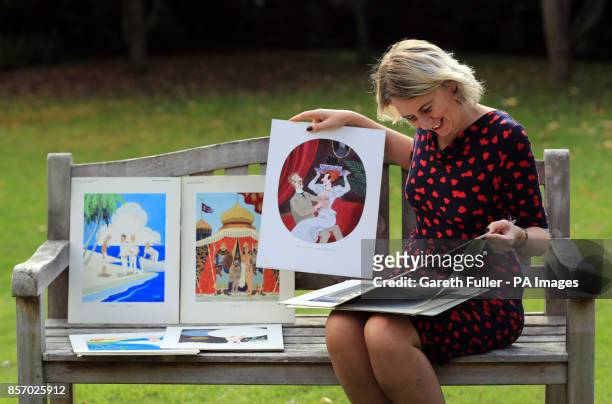 Auctioneer Catherine Southon holds examples from the Smilby cartoon collection, including works that appeared in Playboy, at the Ripley Arts Centre,...