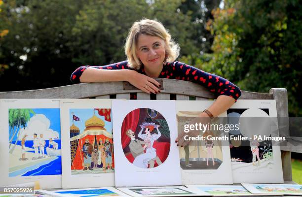 Auctioneer Catherine Southon holds examples from the Smilby cartoon collection, including works that appeared in Playboy, at the Ripley Arts Centre,...