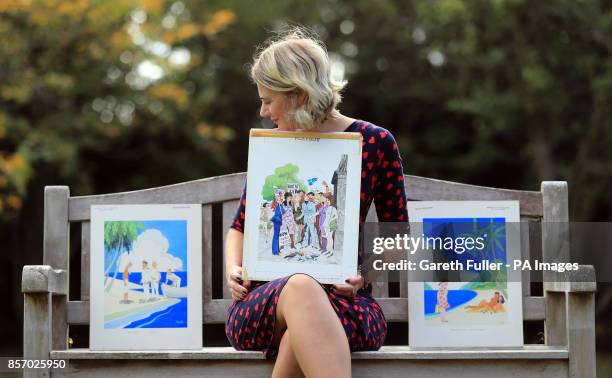 Auctioneer Catherine Southon holds examples from the Smilby cartoon collection, including works that appeared in Playboy, at the Ripley Arts Centre,...