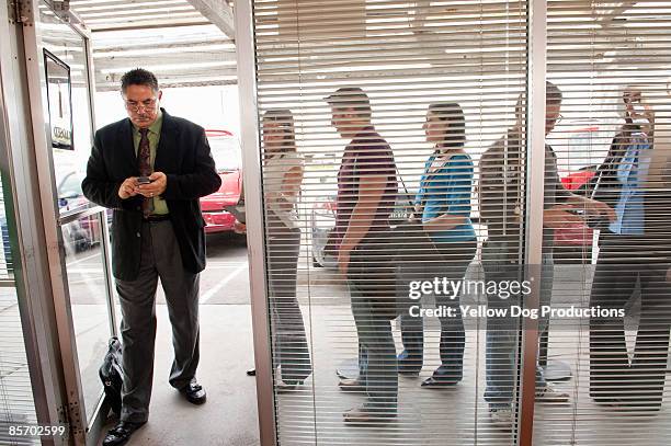 line outside unemployment office - unemployment foto e immagini stock