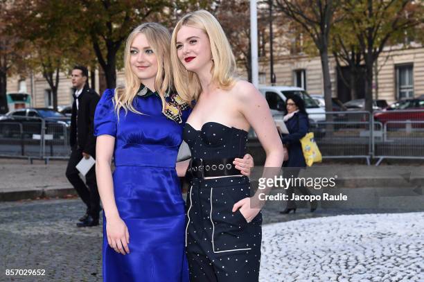 Dakota Fanning and Elle Fanning are seen arriving at Miu Miu show during Paris Fashion Week Womenswear Spring/Summer 2018 on October 3, 2017 in...