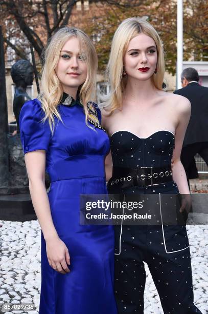 Dakota Fanning and Elle Fanning are seen arriving at Miu Miu show during Paris Fashion Week Womenswear Spring/Summer 2018 on October 3, 2017 in...