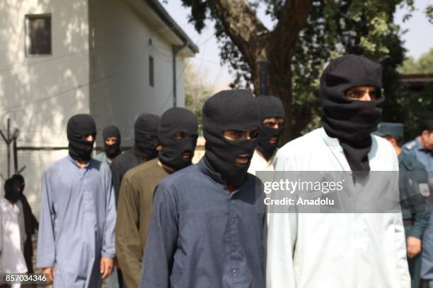 Members of Daesh and 5 members of Taliban are seen unarmed as they captured by Afghan authorities in Nangarhar, Afghanistan on October 3, 2017.