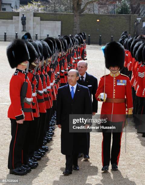 President Felipe Calderon of Mexico, accompanied by Prince Philip, Duke of Edinburgh, inspects a Guard of Honour during an official ceremonial...