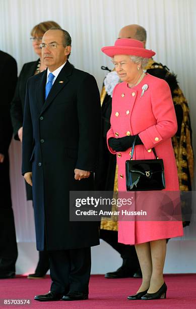 Queen Elizabeth ll meets President Felipe Calderon of Mexico during an official ceremonial welcome at Horse Guards Parade on March 30, 2009 in...